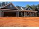 This is a one-story home with a large garage and a covered front porch at 554 Presley Farm Pkwy, Rockmart, GA 30153