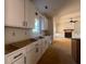 View from kitchen highlighting the white cabinets and appliances at 554 Presley Farm Pkwy, Rockmart, GA 30153
