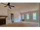 Bright living room with view of the kitchen, backyard, and a modern shiplap fireplace at 554 Presley Farm Pkwy, Rockmart, GA 30153