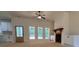 Bright living room with a ceiling fan, fireplace and built-in cabinets, and lots of natural light at 554 Presley Farm Pkwy, Rockmart, GA 30153