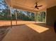 Covered patio with ceiling fan overlooking a large backyard at 554 Presley Farm Pkwy, Rockmart, GA 30153
