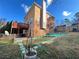 Exterior view of the house and backyard featuring a brick chimney and a two-level wooden deck at 1418 Brookside Manor Ct, Tucker, GA 30084