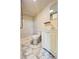Bathroom featuring a marble-style tile shower, a toilet, and a white vanity with a sink at 1418 Brookside Manor Ct, Tucker, GA 30084
