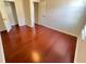 Bedroom with hardwood floors and closet space for plenty of storage at 1418 Brookside Manor Ct, Tucker, GA 30084