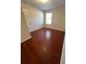 Bedroom with wood floors and a window for natural light at 1418 Brookside Manor Ct, Tucker, GA 30084