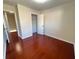 Bedroom featuring wood floors and two doors at 1418 Brookside Manor Ct, Tucker, GA 30084