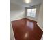 Bedroom featuring hardwood floors and a window at 1418 Brookside Manor Ct, Tucker, GA 30084