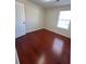 Bedroom with wood floors and a window for natural light at 1418 Brookside Manor Ct, Tucker, GA 30084