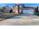 Charming two-story brick home with a two-car garage and well-manicured lawn at 1418 Brookside Manor Ct, Tucker, GA 30084