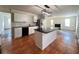 Open kitchen featuring a black granite island, stainless appliances, and ample counter space at 1418 Brookside Manor Ct, Tucker, GA 30084