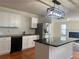 This kitchen has stainless appliances, granite counters, white cabinets, and a subway tile backsplash at 1418 Brookside Manor Ct, Tucker, GA 30084