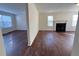 Bright living room features hardwood floors and a cozy fireplace at 1418 Brookside Manor Ct, Tucker, GA 30084