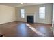 Bright living room with hardwood floors and a cozy fireplace at 1418 Brookside Manor Ct, Tucker, GA 30084