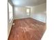 Spacious living room with hardwood floors and plenty of natural light at 1418 Brookside Manor Ct, Tucker, GA 30084