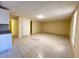 Spacious living space featuring tile flooring, white cabinets, neutral walls and ceiling tiles at 1418 Brookside Manor Ct, Tucker, GA 30084