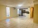 Spacious living area features white cabinets, a stainless steel refrigerator, and tile flooring at 1418 Brookside Manor Ct, Tucker, GA 30084
