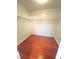 Walk-in closet with wood floors and shelves at 1418 Brookside Manor Ct, Tucker, GA 30084