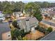 Aerial view of a home with mature trees and well-maintained landscaping at 1548 Pinebreeze Dr, Marietta, GA 30062