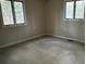 Cozy bedroom featuring two windows providing plenty of natural light at 2720 Sandy Creek Cir, Loganville, GA 30052