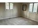 Bedroom featuring two large windows and a mirror at 2720 Sandy Creek Cir, Loganville, GA 30052
