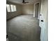 Spacious bedroom featuring a ceiling fan and large windows at 2720 Sandy Creek Cir, Loganville, GA 30052