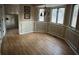 Dining room with hardwood floors, large windows, and chandelier at 2720 Sandy Creek Cir, Loganville, GA 30052