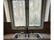 Kitchen sink with window view at 2720 Sandy Creek Cir, Loganville, GA 30052