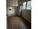 Bright laundry room featuring wood floors, storage cabinets, and a window at 2720 Sandy Creek Cir, Loganville, GA 30052