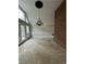 Spacious living room featuring a chandelier, carpeted floors, and a brick wall at 2720 Sandy Creek Cir, Loganville, GA 30052