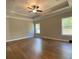 Bright, spacious bedroom with hardwood floors, tray ceilings, and two windows at 642 Presley Farm Pkwy, Rockmart, GA 30153
