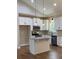 Bright kitchen with island, granite countertops, and stainless steel appliances at 642 Presley Farm Pkwy, Rockmart, GA 30153
