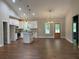 Open-concept kitchen with white cabinets, modern appliances, and an island with a sink at 642 Presley Farm Pkwy, Rockmart, GA 30153