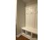Well-organized mudroom features coat hooks and bench with storage at 642 Presley Farm Pkwy, Rockmart, GA 30153
