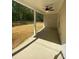 Spacious covered patio with a ceiling fan at 642 Presley Farm Pkwy, Rockmart, GA 30153