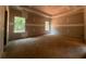 Spacious bedroom featuring two windows offering a view of the surrounding greenery at 642 Presley Farm Pkwy, Rockmart, GA 30153