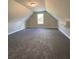Large bonus room features carpet and a window for natural light at 642 Presley Farm Pkwy, Rockmart, GA 30153