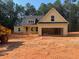 Charming new construction home featuring a two-car garage and unfinished yard at 642 Presley Farm Pkwy, Rockmart, GA 30153