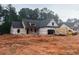 New construction exterior view with a delivery truck parked outside at 642 Presley Farm Pkwy, Rockmart, GA 30153