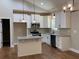 Modern kitchen featuring granite countertops and an island at 642 Presley Farm Pkwy, Rockmart, GA 30153