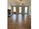 Open living space with hardwood floors, vaulted ceilings, and a cozy fireplace at 642 Presley Farm Pkwy, Rockmart, GA 30153