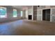 Bright living room showcasing large windows, fireplace, and open floor plan at 642 Presley Farm Pkwy, Rockmart, GA 30153
