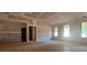 Bright living room featuring a vaulted ceiling, and views to the outdoors at 642 Presley Farm Pkwy, Rockmart, GA 30153