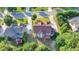 A high angle aerial view of a home with a deck and verdant backyard in a residential neighborhood at 1755 Riverpark Dr, Dacula, GA 30019
