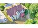 Drone shot of backyard featuring a deck, well-maintained lawn, mature trees, and home's exterior at 1755 Riverpark Dr, Dacula, GA 30019