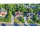 An aerial front view of a brick two-story home with a driveway and a well-maintained lawn at 1755 Riverpark Dr, Dacula, GA 30019