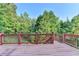 Wooden back deck overlooking a wooded area at 1755 Riverpark Dr, Dacula, GA 30019