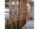 Exposed wooden frame of an unfinished basement with exposed insulation, concrete floor and doorway to another area at 1755 Riverpark Dr, Dacula, GA 30019