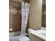 Bathroom featuring tub with shower and floral-patterned shower curtain at 1755 Riverpark Dr, Dacula, GA 30019