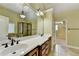 Bright bathroom featuring a double vanity, tile floor, and a glass-enclosed shower at 1755 Riverpark Dr, Dacula, GA 30019
