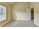 Neutral bedroom featuring carpet and a window that provides a blank canvas to personalize at 1755 Riverpark Dr, Dacula, GA 30019